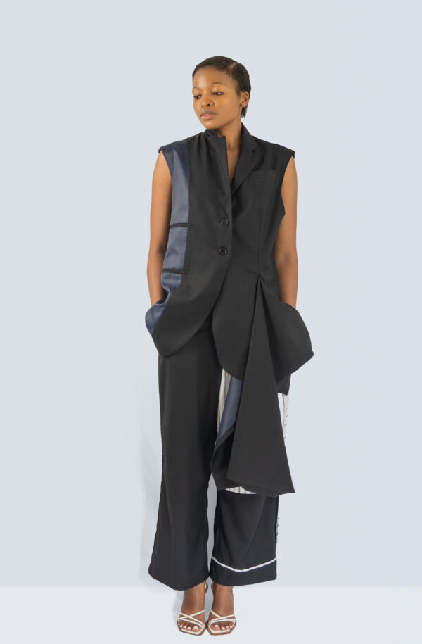 A front view of a woman wearing a stylish waistcoat with front drape