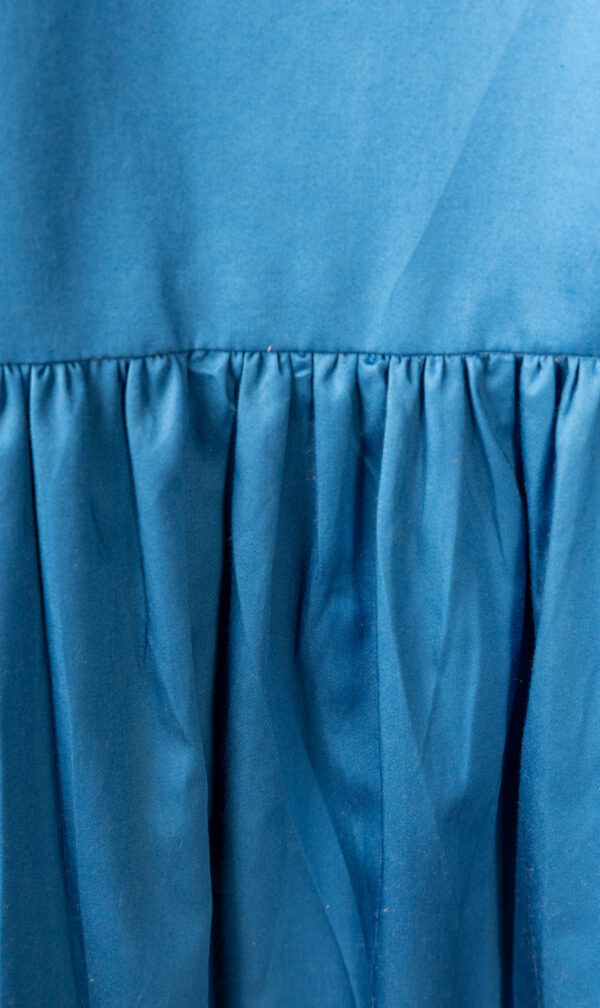 An image of a detailed view of a Plus Size Shirt Dress with front pockets