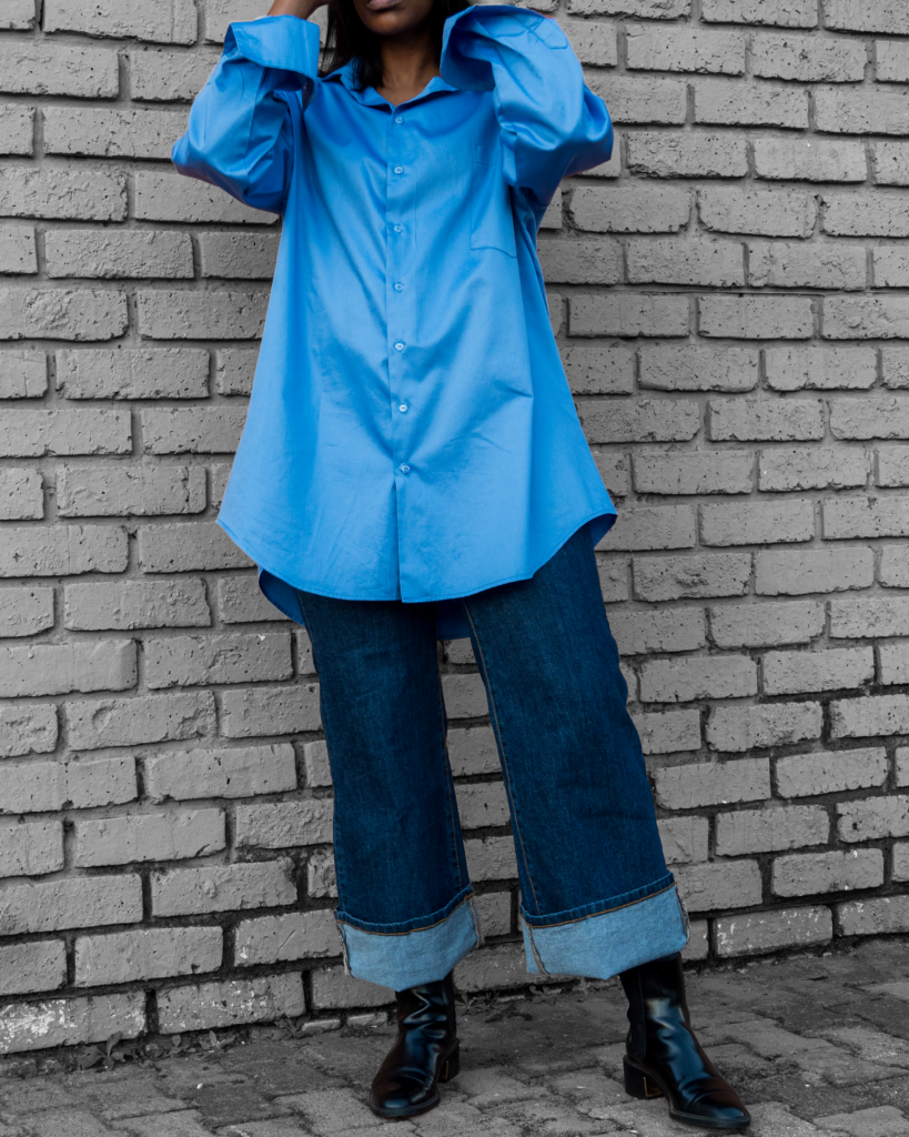 A woman wearing oversized shirt