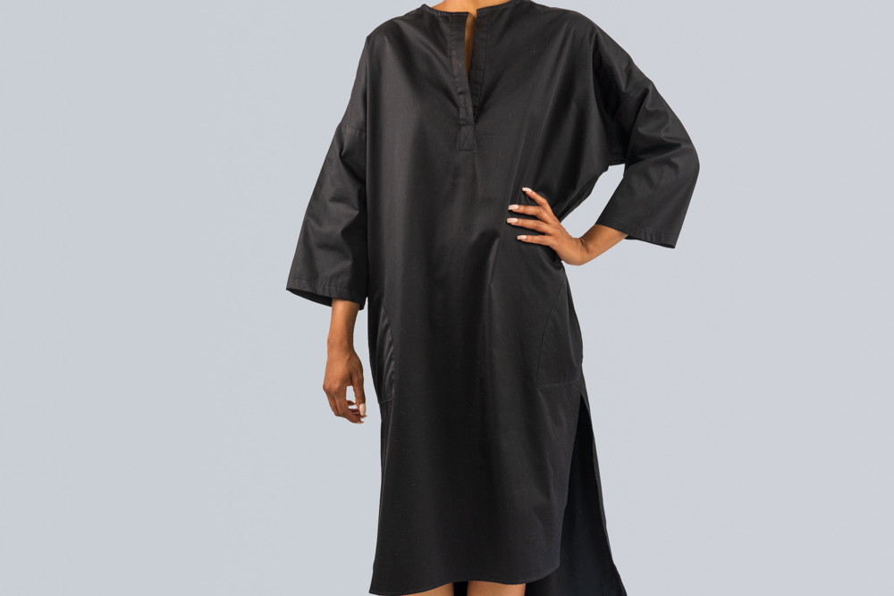 Shirt Dress Front - A front view of a collarless shirt dress with side slits