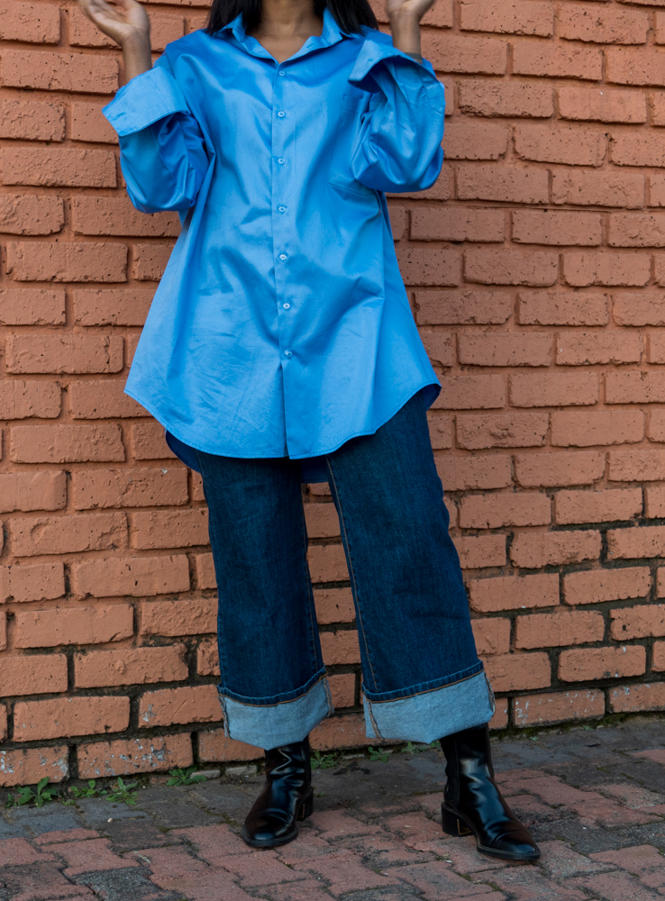 Shirt front - A front view of a woman wearing an oversized shirt