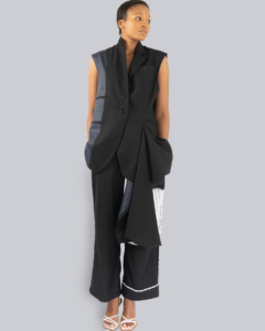 An image of a woman wearing an asymmetrical waistcoat