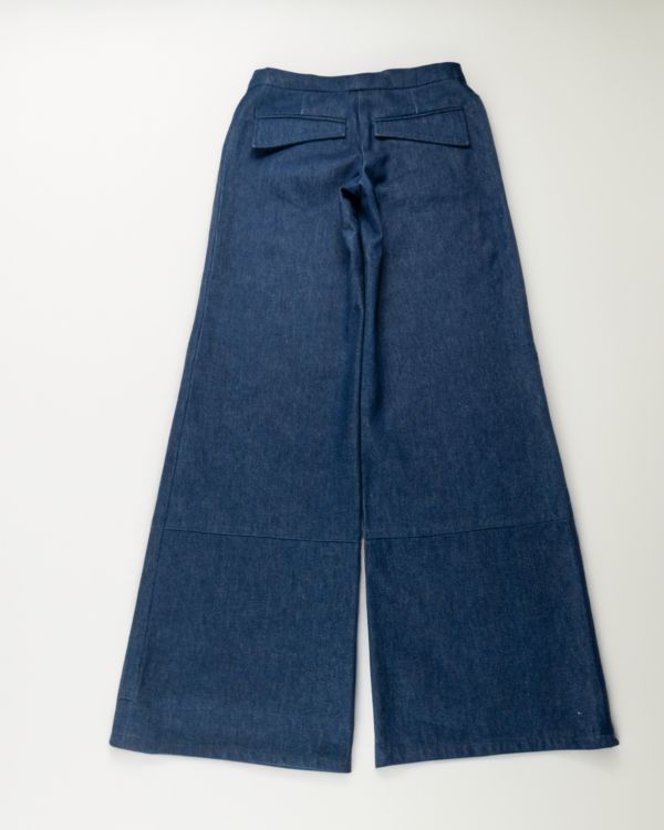An image of a back view of the wide leg blue denim pants