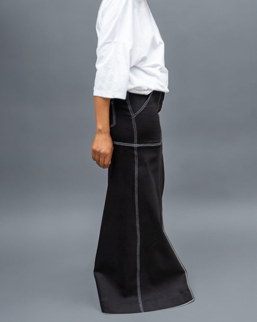 A woman wearing a long skirt