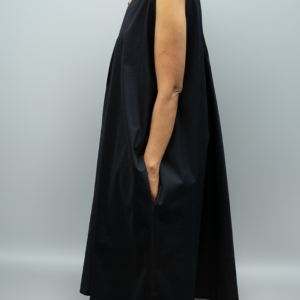 Side view of plus size black sleeveless dress