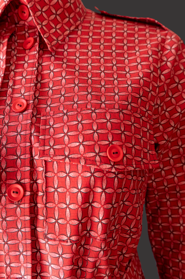 a top front pocket of a red shweshwe dress