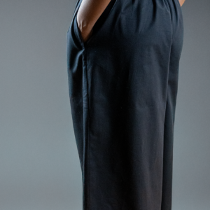 a side view of wide leg black cotton culottes