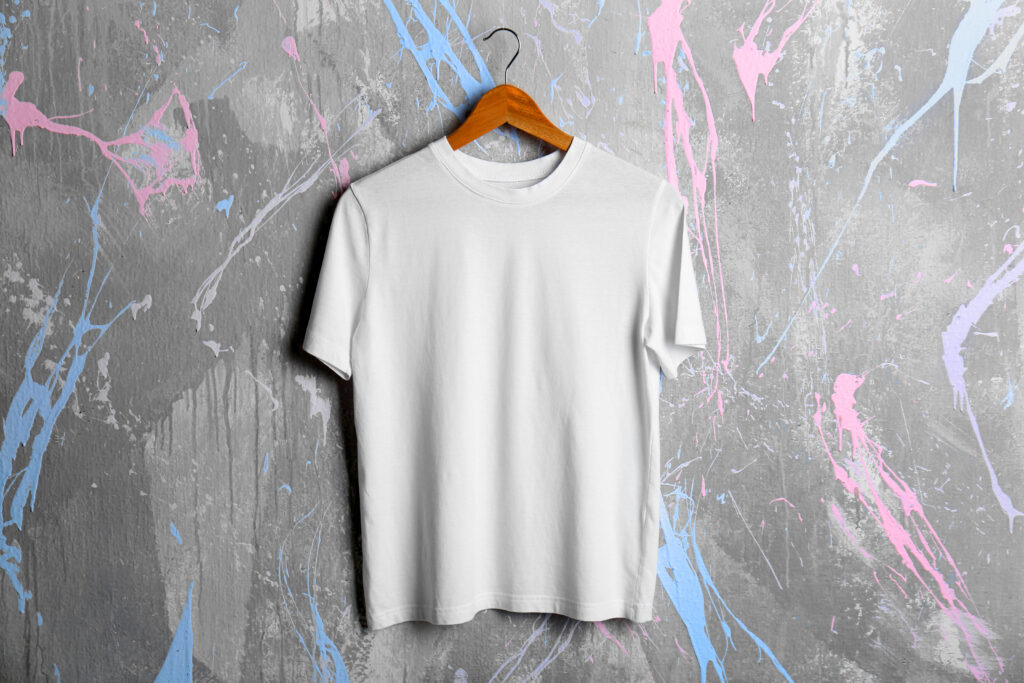 Blank white t-shirt on grunge background - quality T -shirt